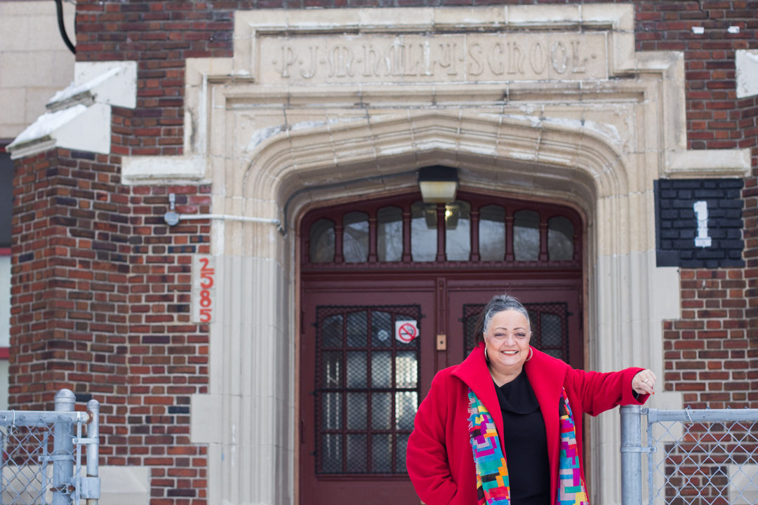 Kearny in front of her old school, now the Paul Robeson/Malcolm X Academy