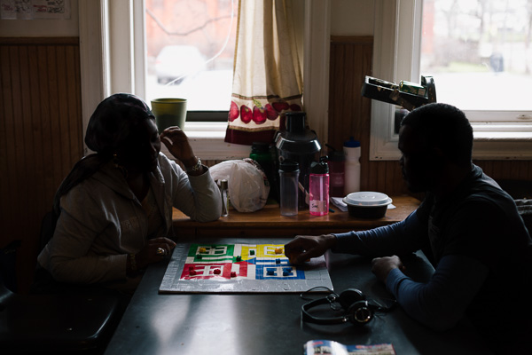 Residents play a homemade board game