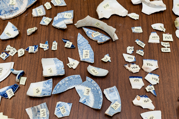 Students must reassemble broken pieces of ceramic mugs and bowls
