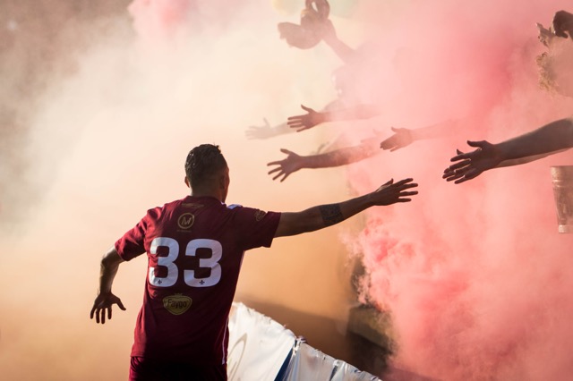 DCFC player high-fives fans through smoke bombs