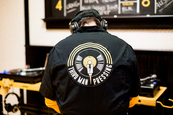 Third Man employee listening to a pressed record