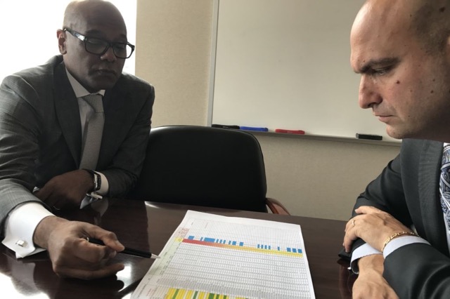 Detroit schools Superintendent Nikolai Vitti consults with Luis Solano, the district’s new chief operating officer