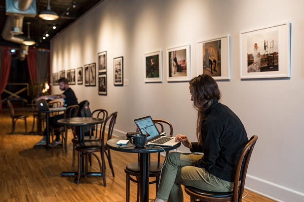 Patrons work at Oloman Cafe