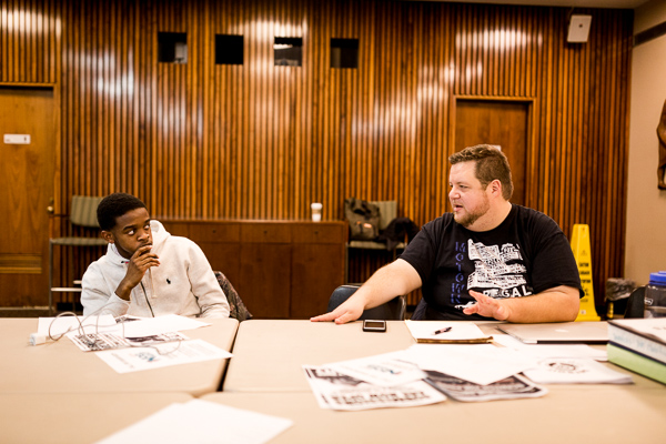 Benjamin Alfaro and a student during a critique of his poem