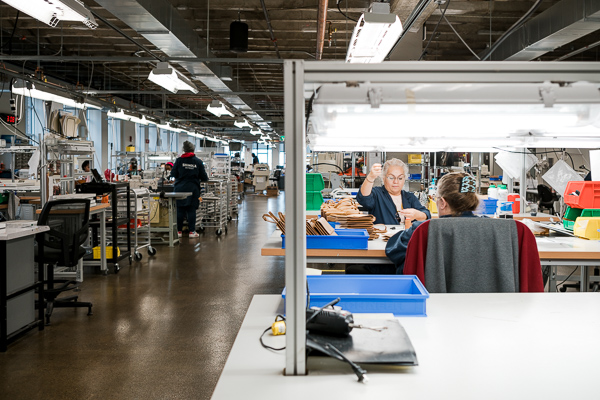 The leather goods floor at Shinola's factory space in New Center