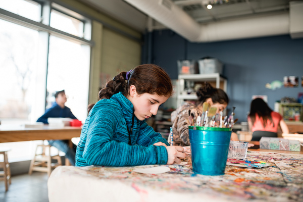 Student Naomi Contreras, working on her art