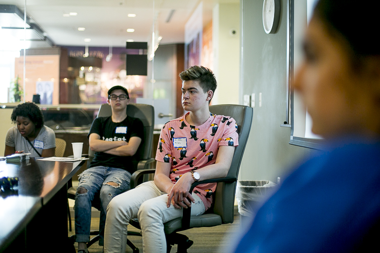 Young people sit in the "Know Your Rights" workshop