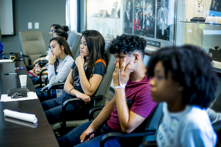 Young people sit in the "Know Your Rights" workshop