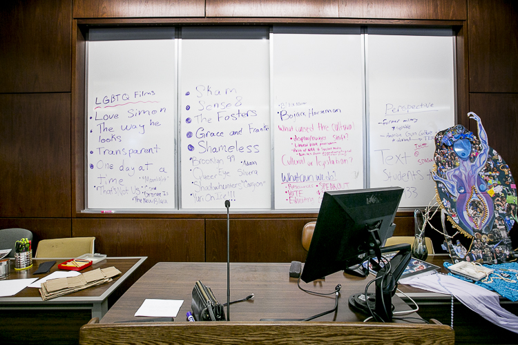 Writing on a white board during the "Revolutionary \ Art" workshop