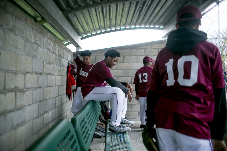Players sit in the dugout at Stoepel Park Park No. 1