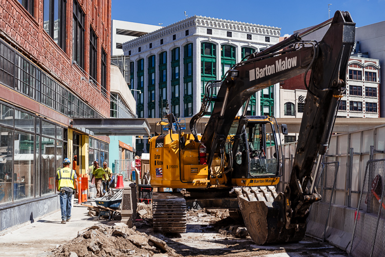 Excavator working near the Shinola Hotel