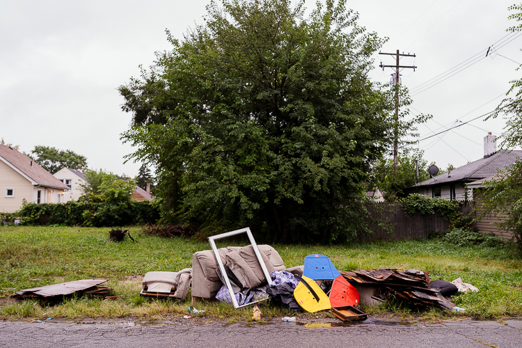 Illegal dumping in a vacant lot.