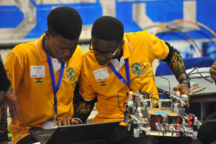 Two international students prepare their Robot during Robofest