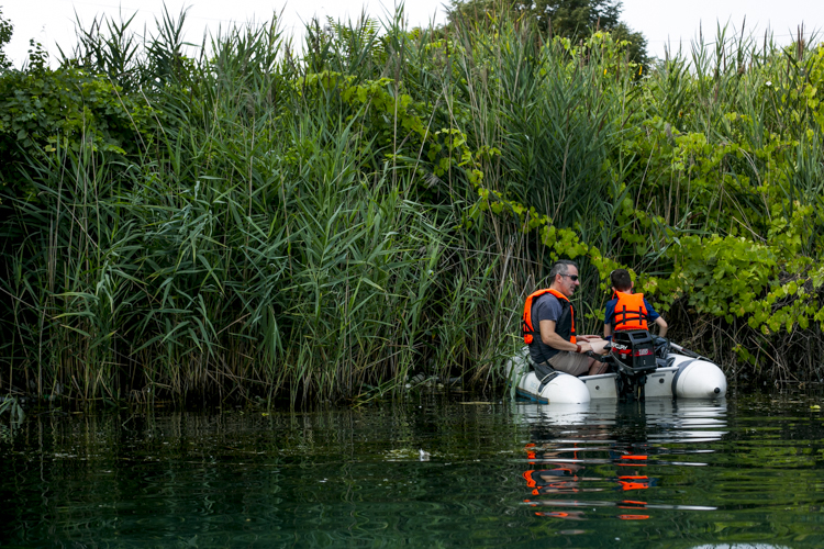 Tom and Mark Nardone pick up garbage near Zug Island