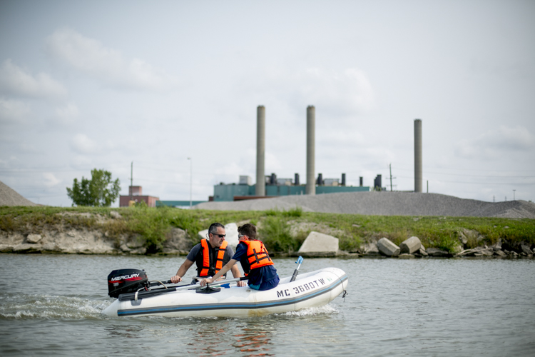 Tom and Mark travel around in their boat during a Trash Fishing outing