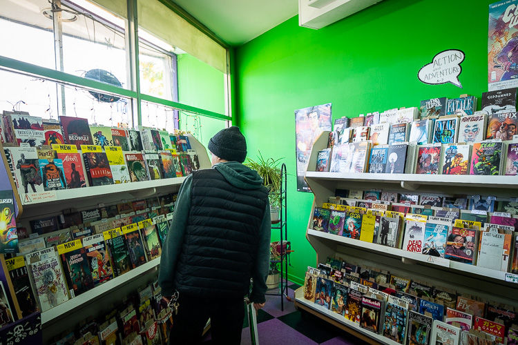 Customer shopping at Green Brain Comics