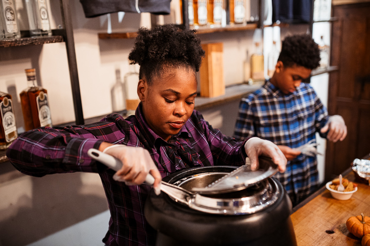 Kamesha McDaniel working with her son Barron