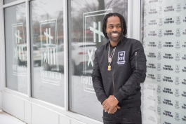 Clement "Fame" Brown Jr., owner of The Three Thirteen, outside the store's new location on Livernois