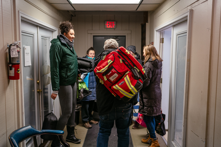 Dean Carpenter, center, and the MSU Detroit Street Care team leave the clinic