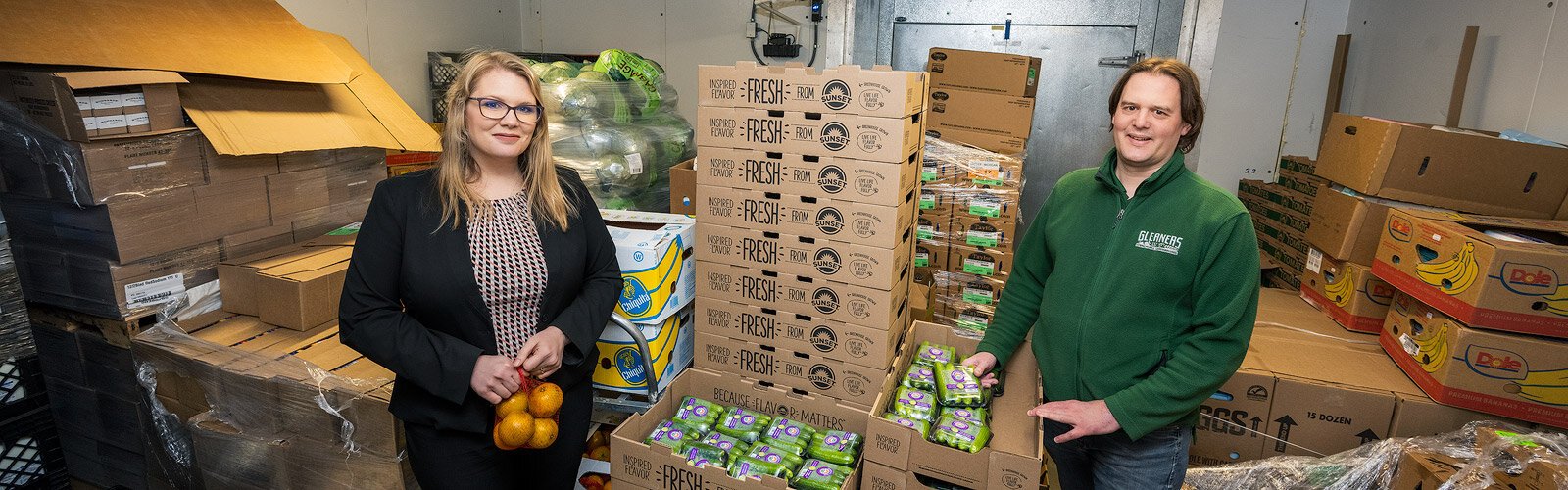 Bridget Brown, director for Gleaners Community Food Bank's Food Secure Livingston program, and Jake Williams, Gleaners' nutrition education manager, at Shared Harvest Pantry in Howell.