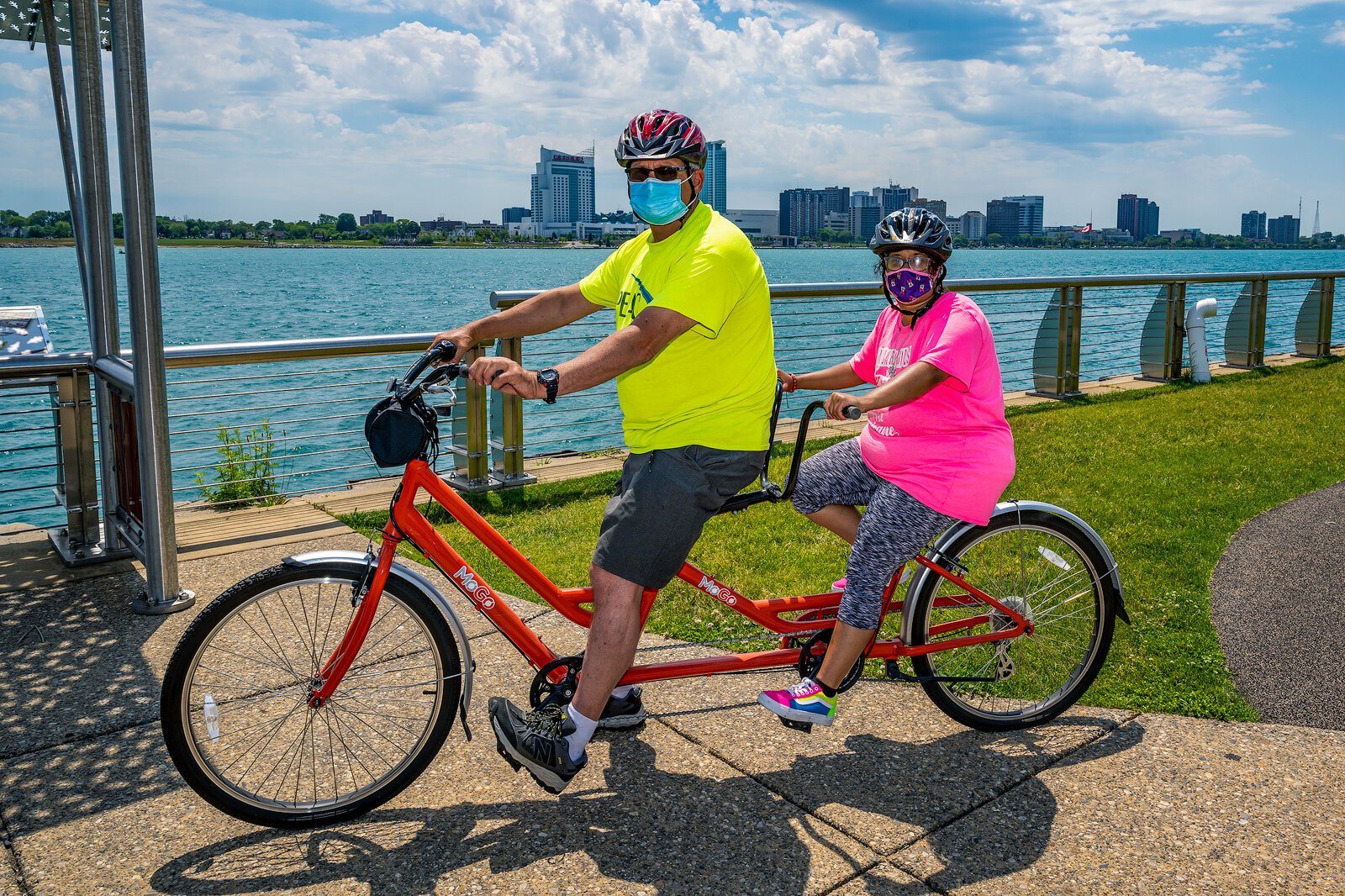 PEAC founder John Waterman and PEAC student Tiara Sims on a MoGo adaptive cycle on the Detroit Riverwalk.