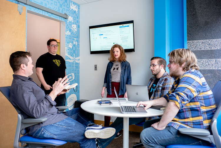 Jake Sigal (left) shares ideas with Tome Software engineers Matt Rathbun, Angela Fessler, Nick Dedenbach, and Ben Willshire.
