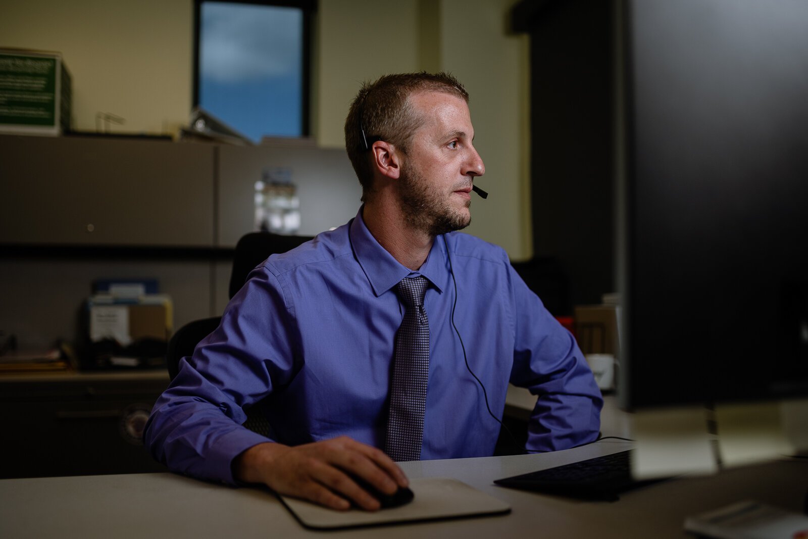 Brian Nicholson, MiCAL program director for Oakland County-based crisis services agency Common Ground, takes a call for the Michigan Crisis and Access Line (MiCAL).