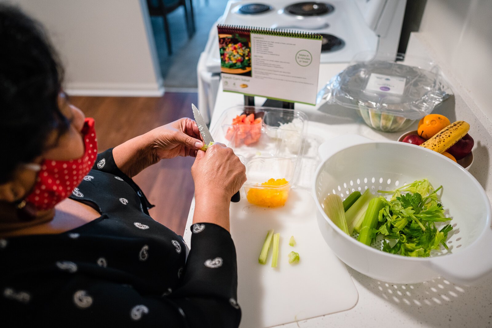 Fresh Conversations participant LaDonna Johnson makes corn salad using a recipe she got from the program.