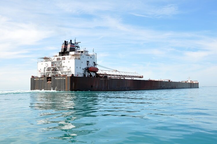 A freigher ventures across the lake.