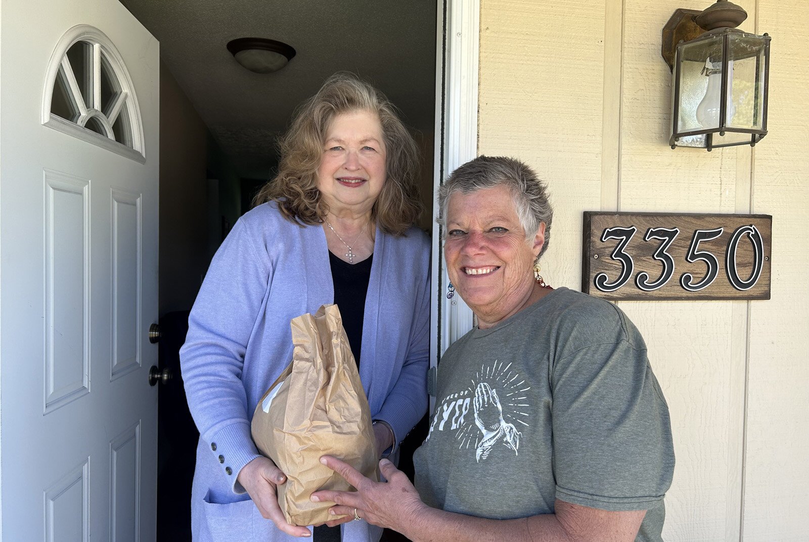 A Meals on Wheels Western Michigan volunteer makes a delivery.