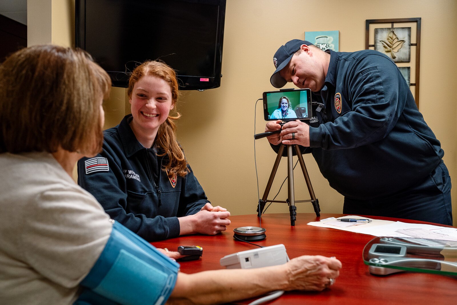 Community integrated paramedics Kim Whalen and Lt. Kevin Bailey of the Bloomfield Township Fire Department conduct a patient visit.