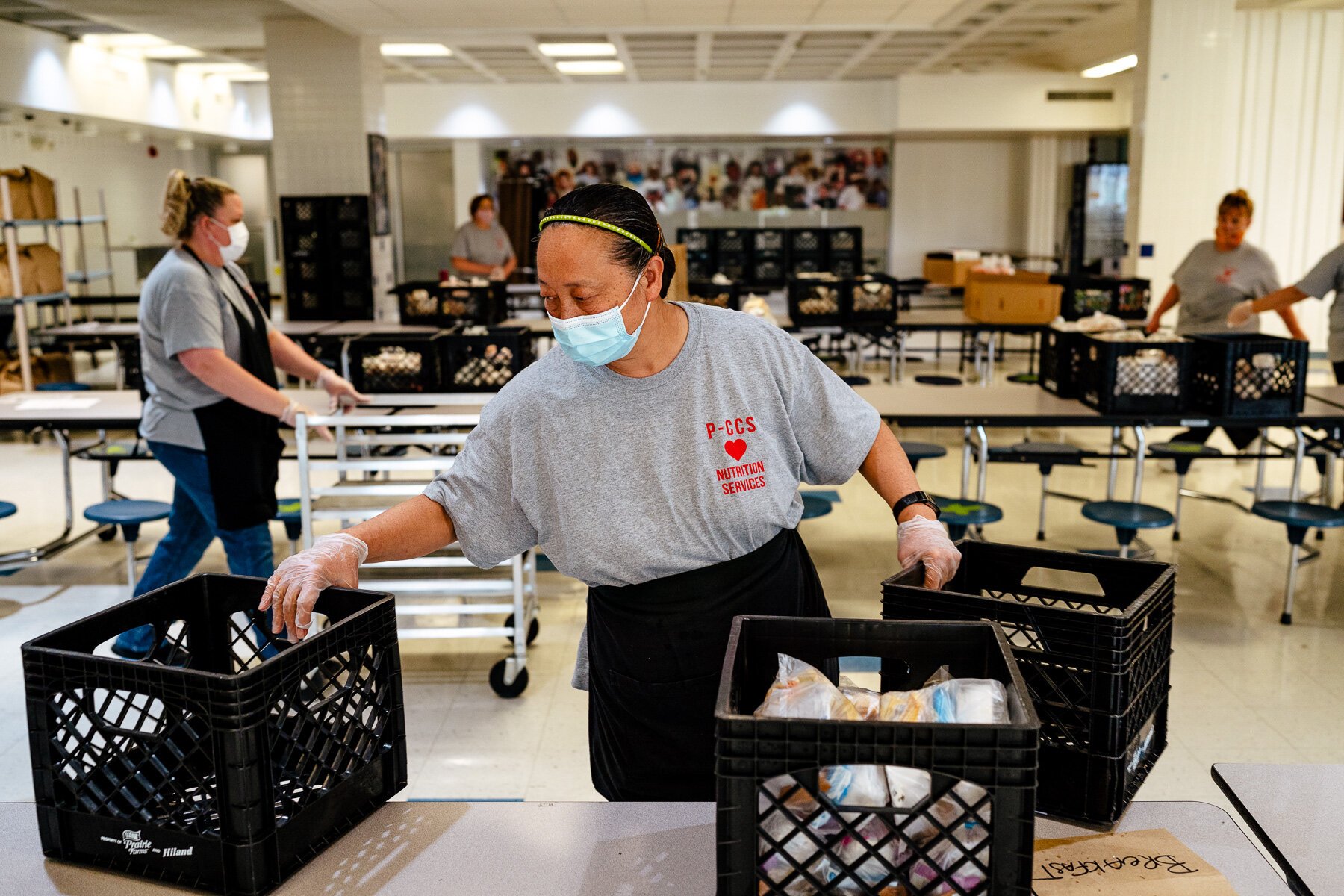 Plymouth-Canton Community Schools staffers prepare meals for pickup.