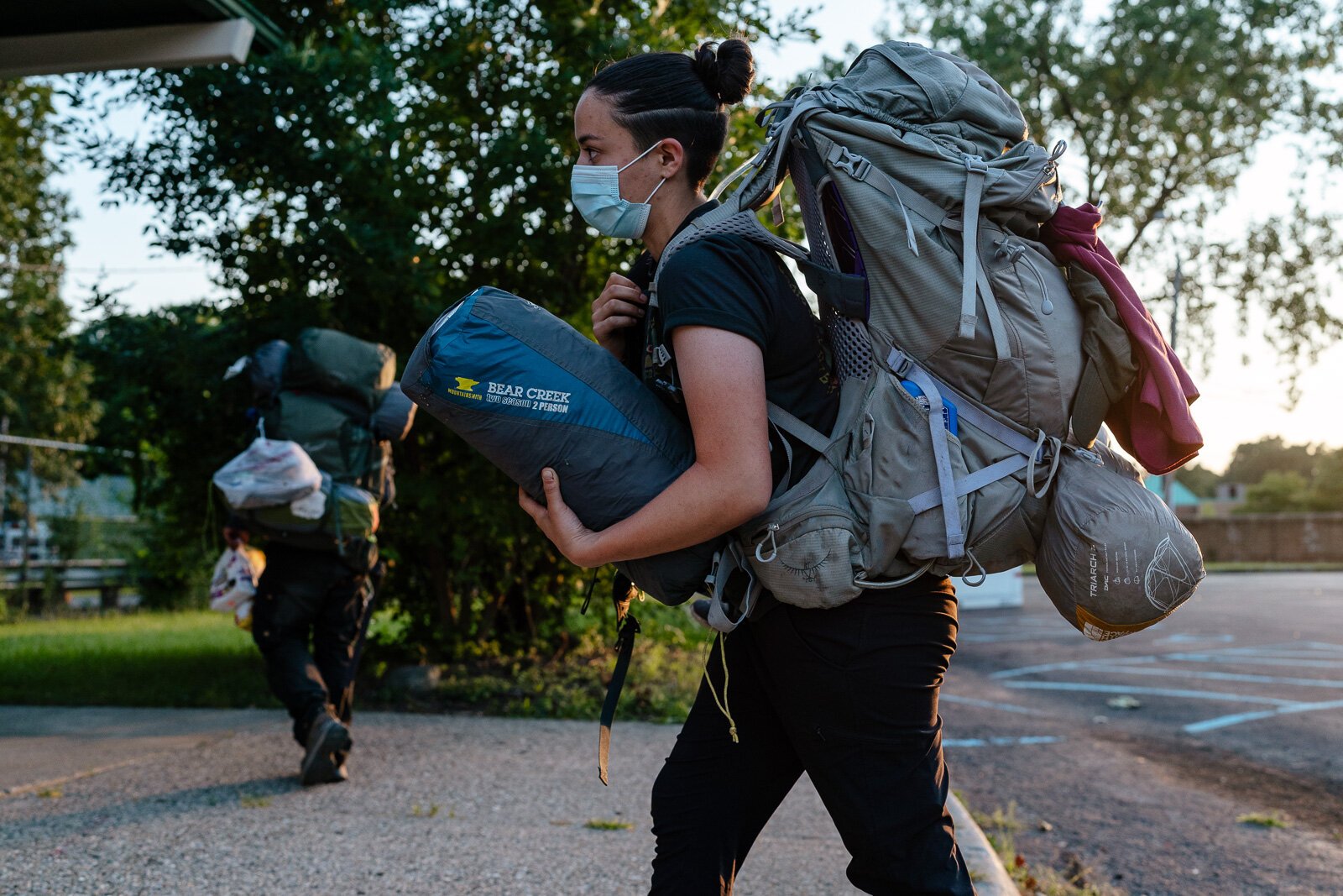 Counselor Natalie Ramos unpacks gear from a Detroit Outdoors camping trip to Pictured Rocks.