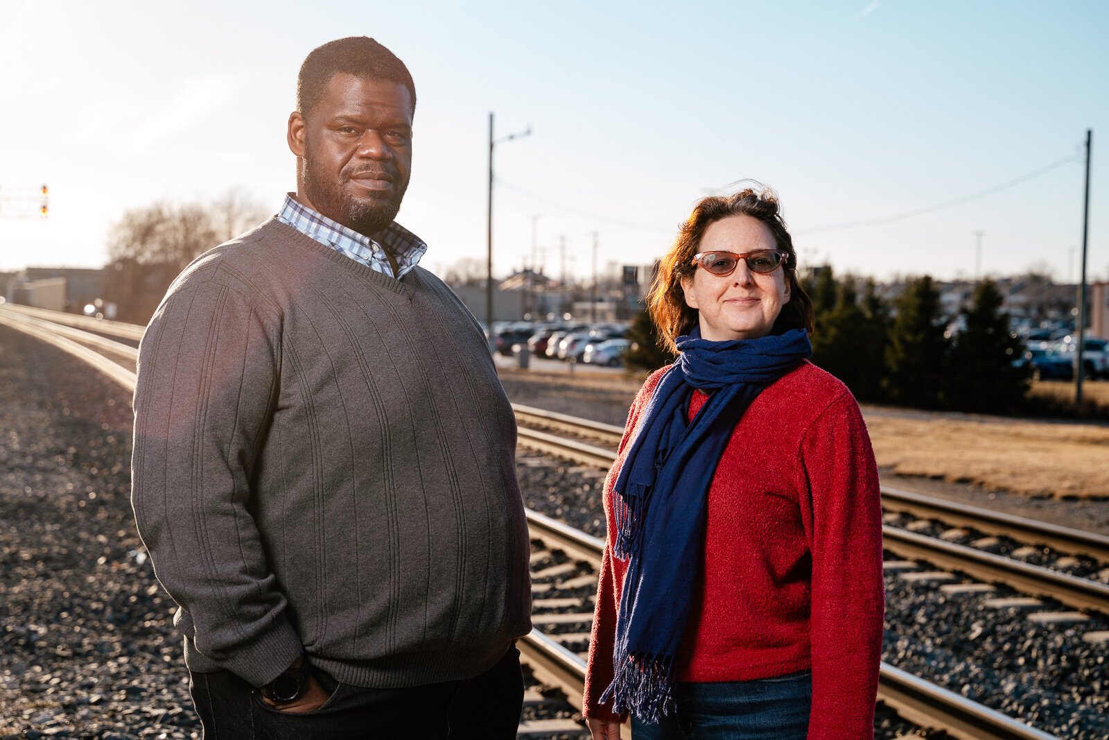 Former Transit Riders United (TRU) board President Donald Stuckey and TRU Executive Director Megan Owens stand by the Amtrak line in Dearborn.