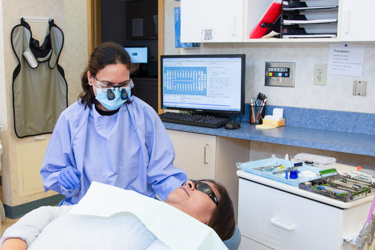 Clinicians work on a patient at Cherry Health.