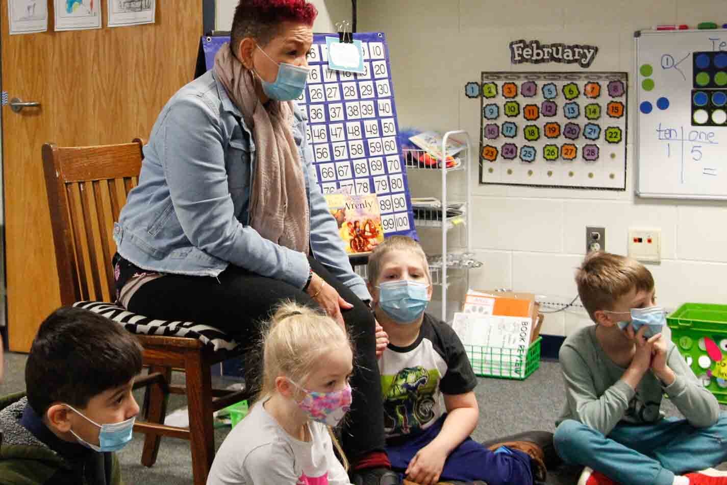 Behavior Specialist Mary Carter asks students at Kalamazoo's Northwood Elementary to discuss their feelings.