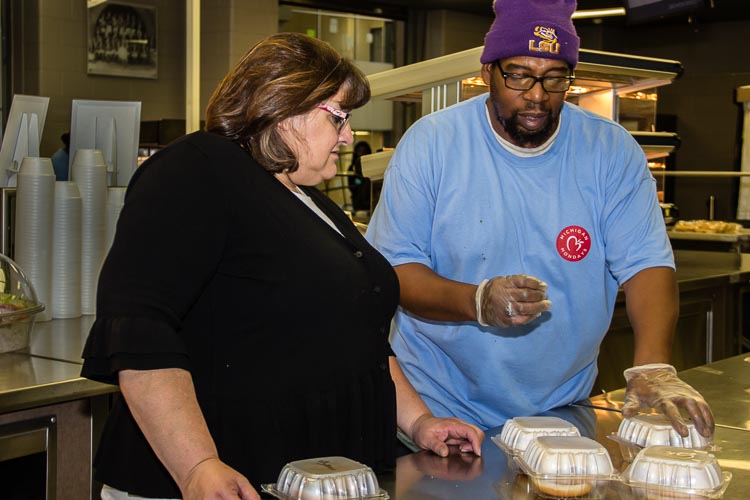 Michelle Morrissey, dining services director for Battle Creek Public Schools, works with Mo Robinson to provide healthy foods for students.