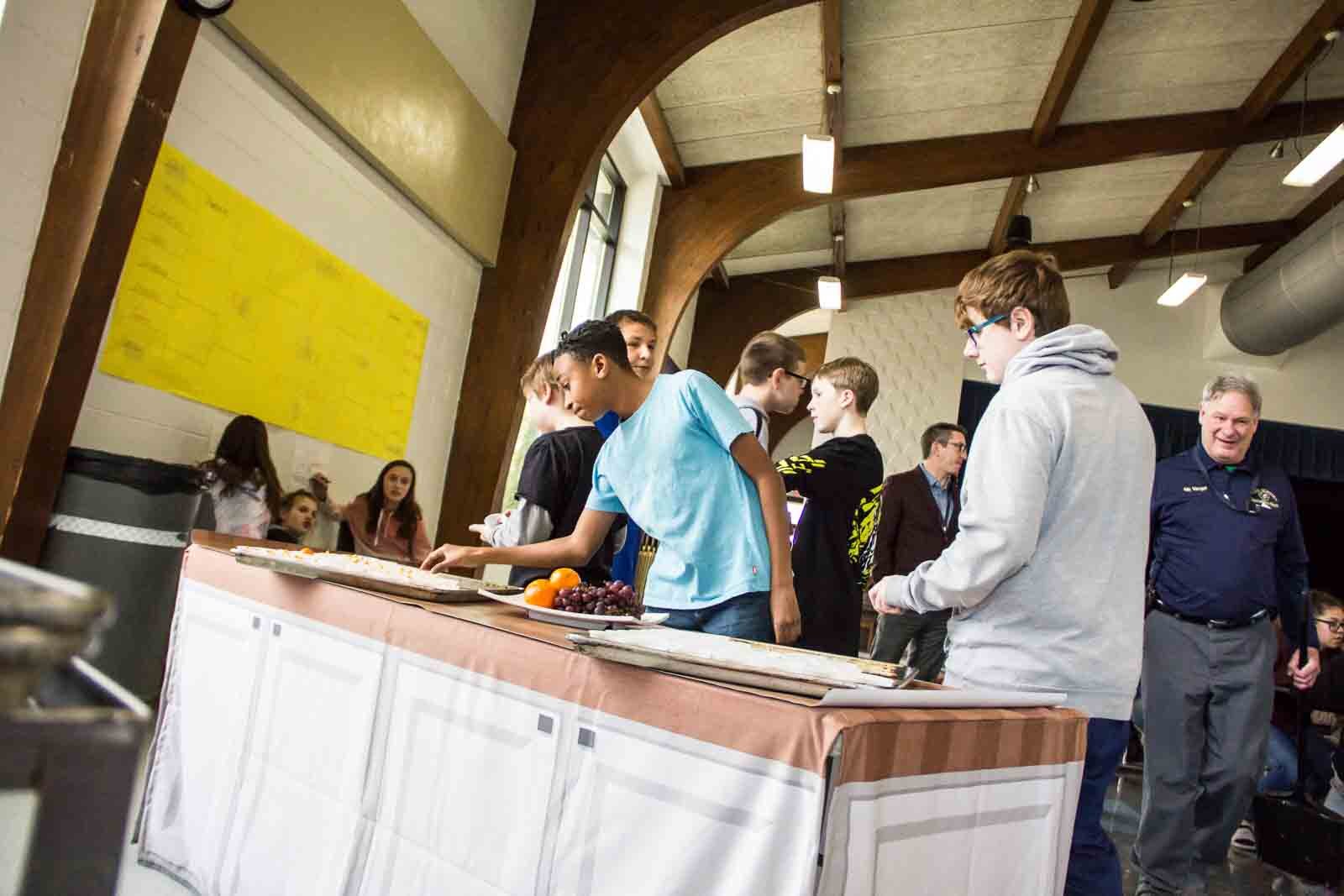 Ring Lardner Middle School students select fruit to taste for March Madness.