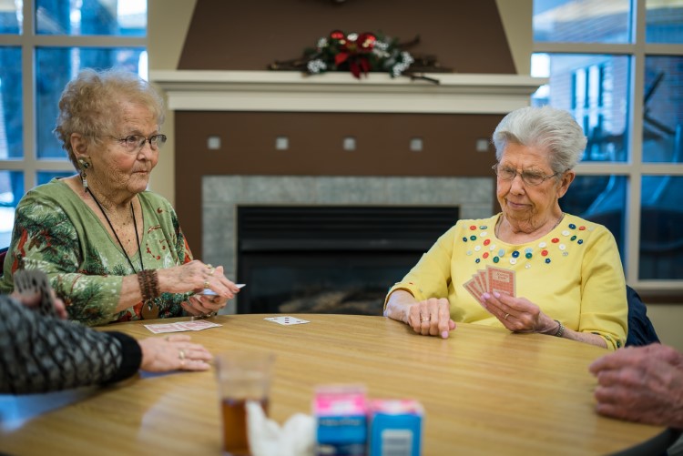 Seniors play poker at Sanford Activity and Dining Center in Midland.