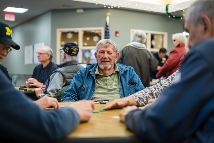 Seniors play poker at Sanford Activity and Dining Center in Midland.