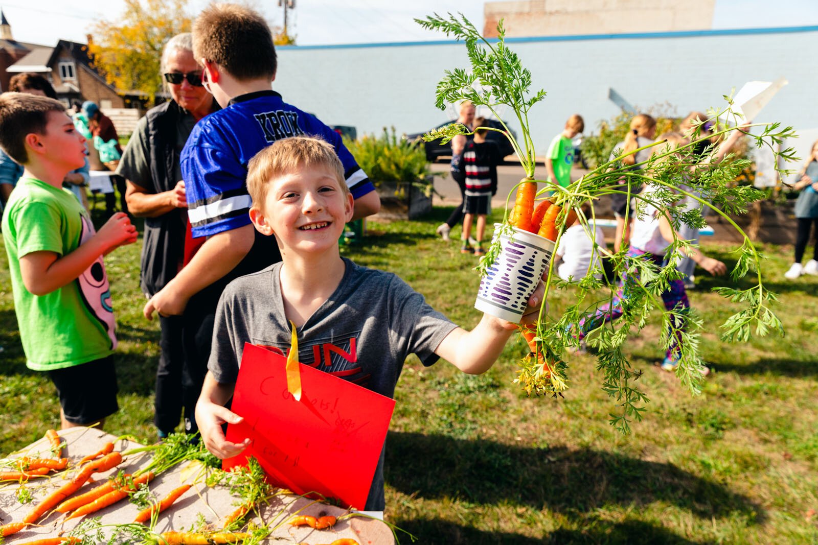 Students run a farm stand as part of Partridge Creek Farm's farm to school program in Ishpeming.