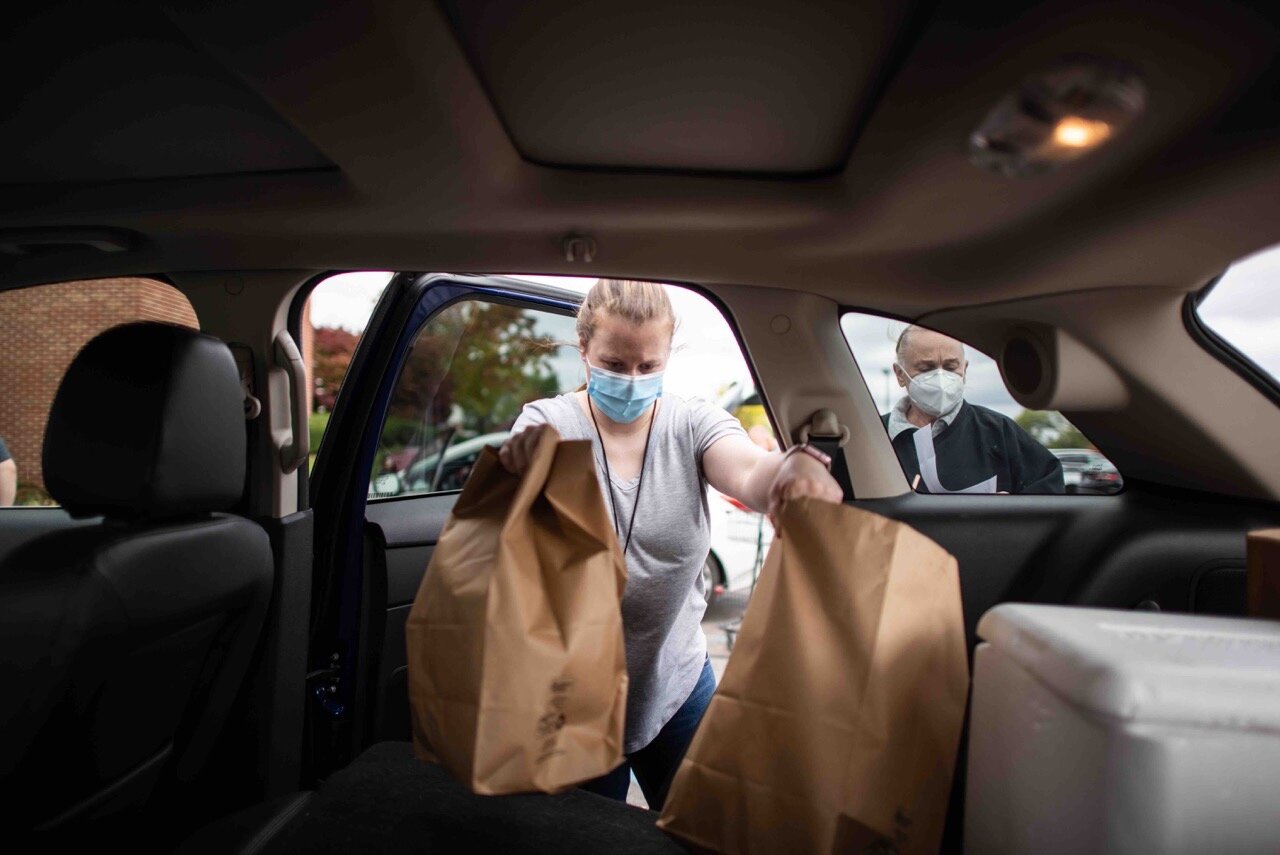 Volunteers help distribute food at Jewish Family Services of Washtenaw County 