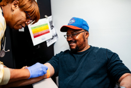 William Butler is prepared to get his blood drawn at HUDA by his nurse, Val Gamble. Butler has been coming to HUDA for his health care needs since he lost his health insurance four years ago.