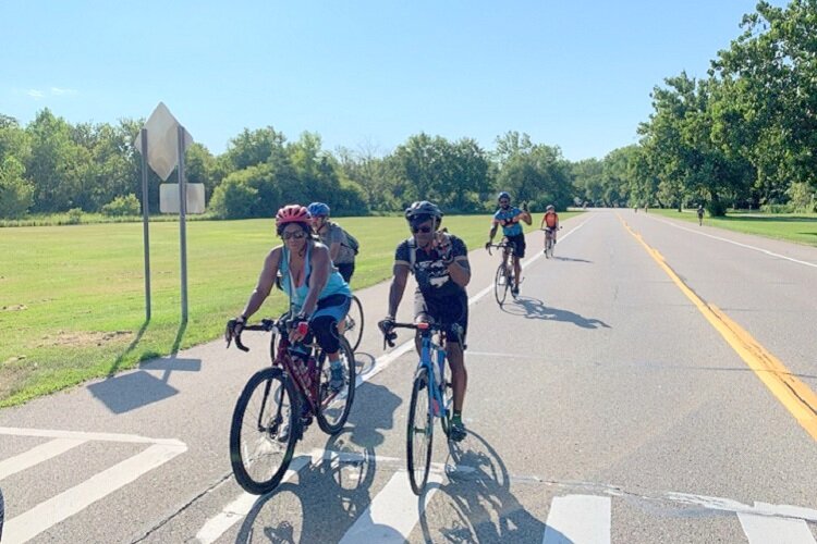 Bicyclists check out Saturday at the Park on Hines Drive.