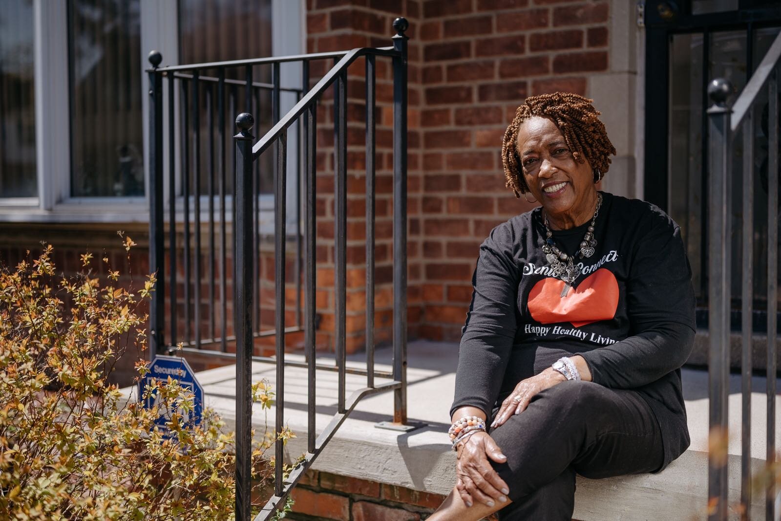 Chris Bond enjoys a peaceful moment on her repaired front porch