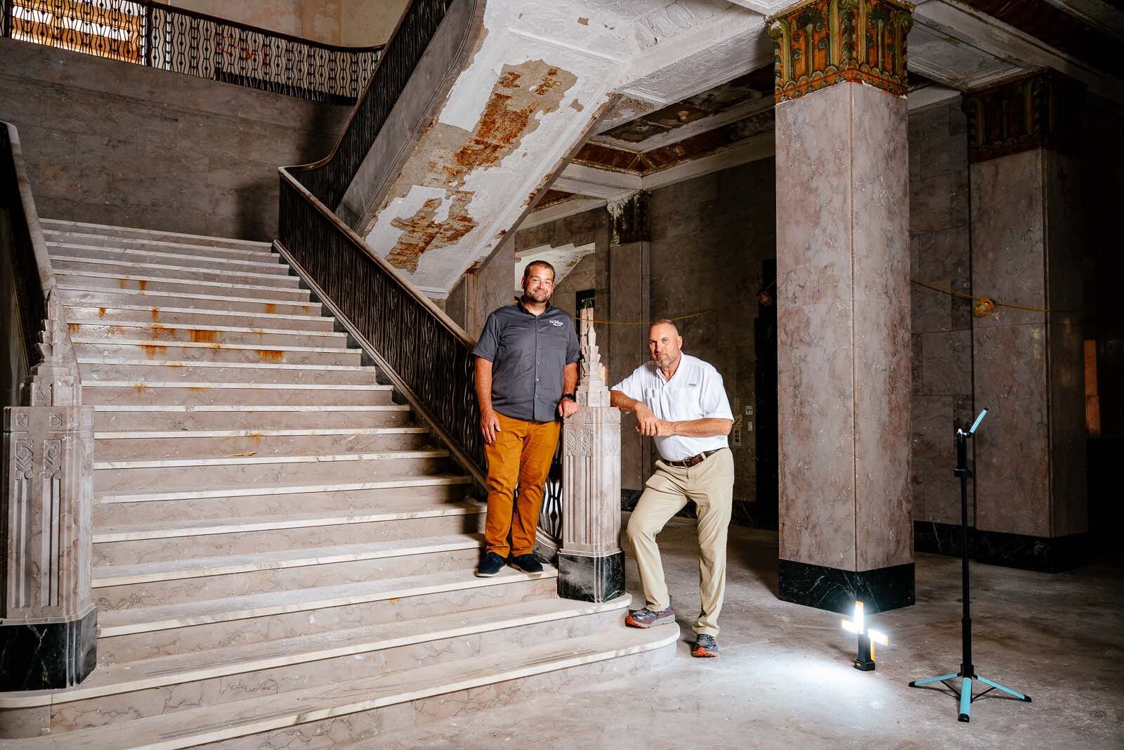 Mark Cochran and Keith Masserant in the main marble staircase of St. Mary's Academy in Monroe